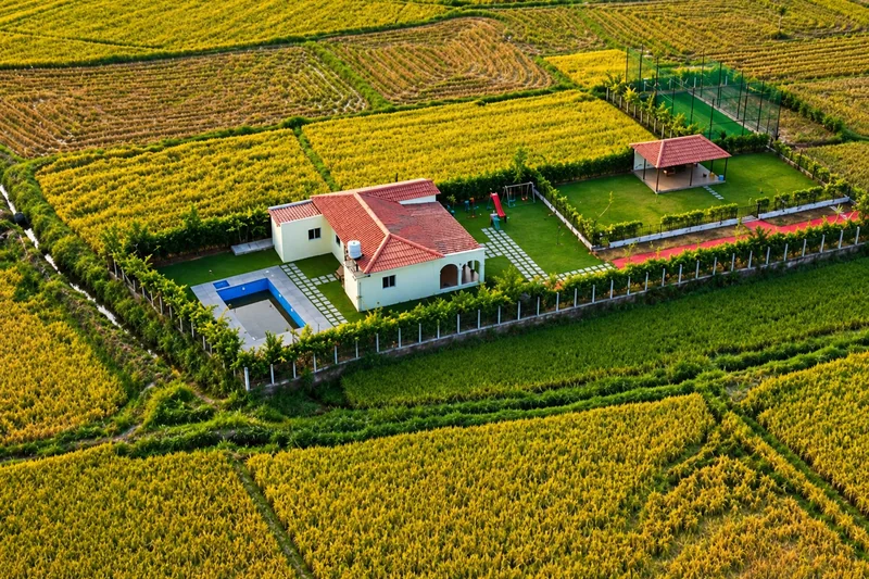 Aerial photograph of the farmhouse, pool and lawn surrounded by fields — AI recreation from supplied reference